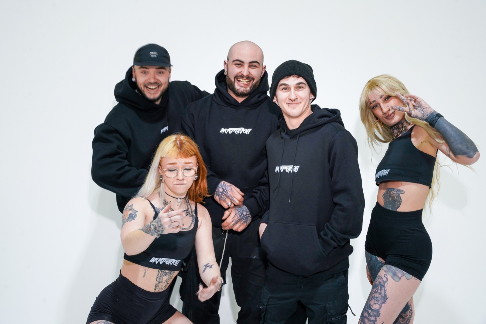 Six of the crew posing in INDEPENDENTco hoodies and sets